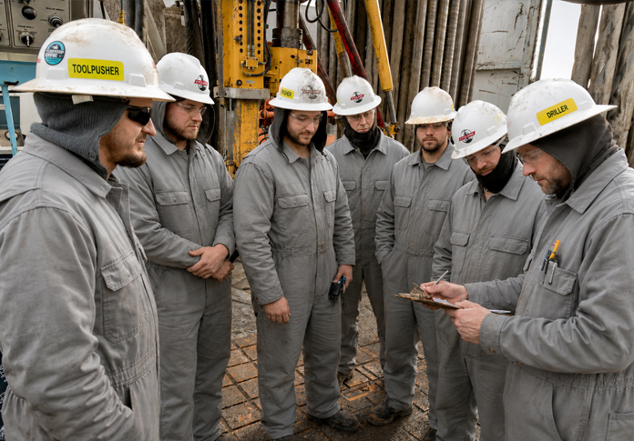 Cyclone Drilling crew in hard hats on the rig
